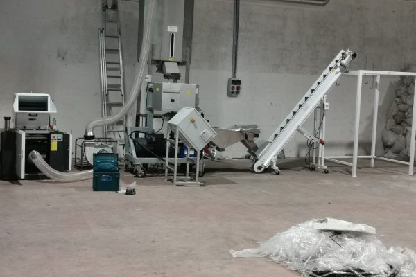 wool shredder and pelleting system with bulk bag storage